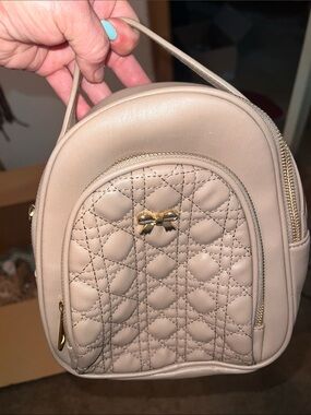 Beige Quilted Mini Backpack with Gold Bow Accent by BLUSH KISS